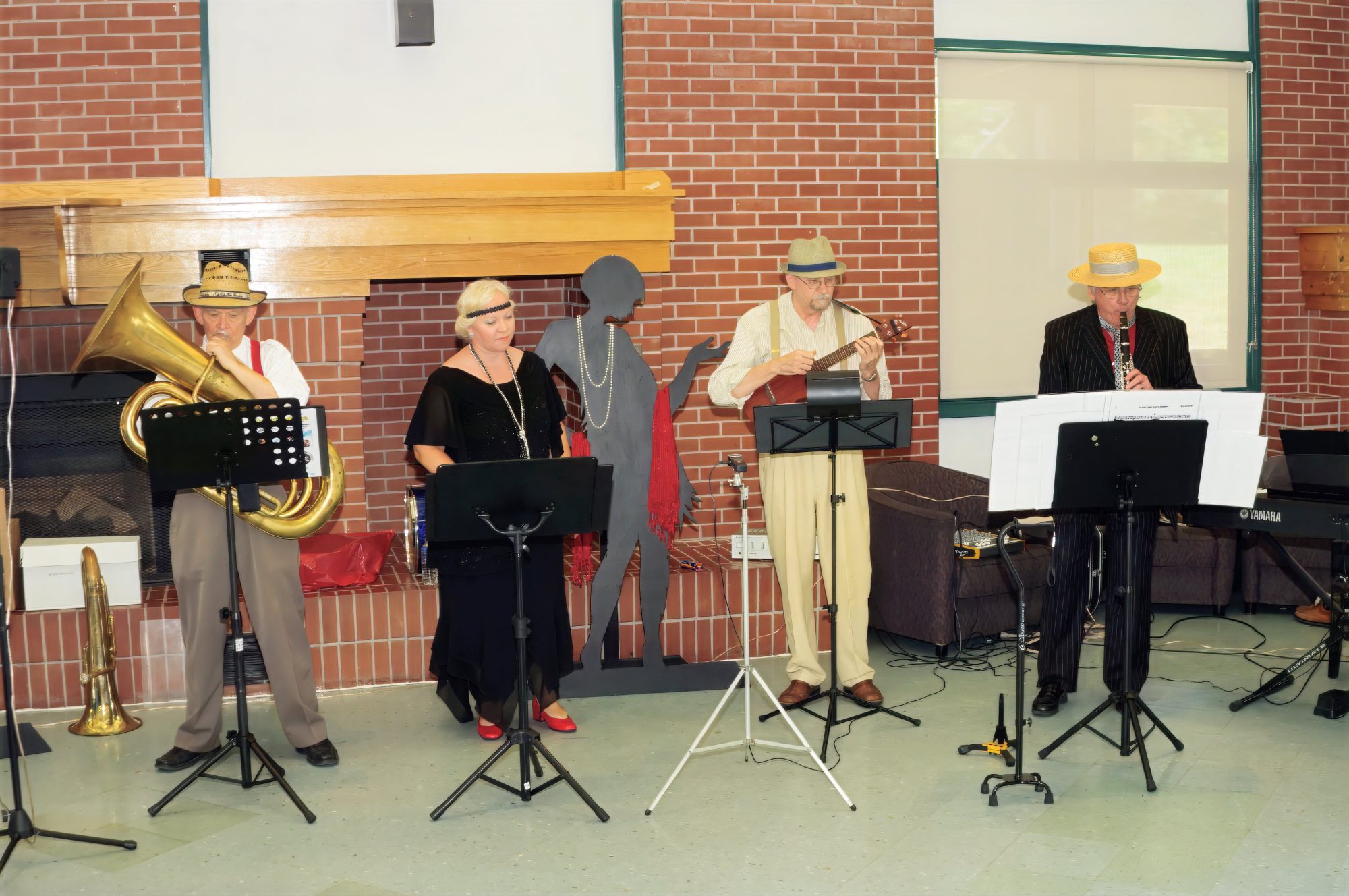 Pictured from left to right: Bill Riley, Katie Ditschun, Ian McIntosh, and Robert Hardy, performing with Participation Music Hall Theatre Productions. Photo by Jeff Poissant, RGD.
